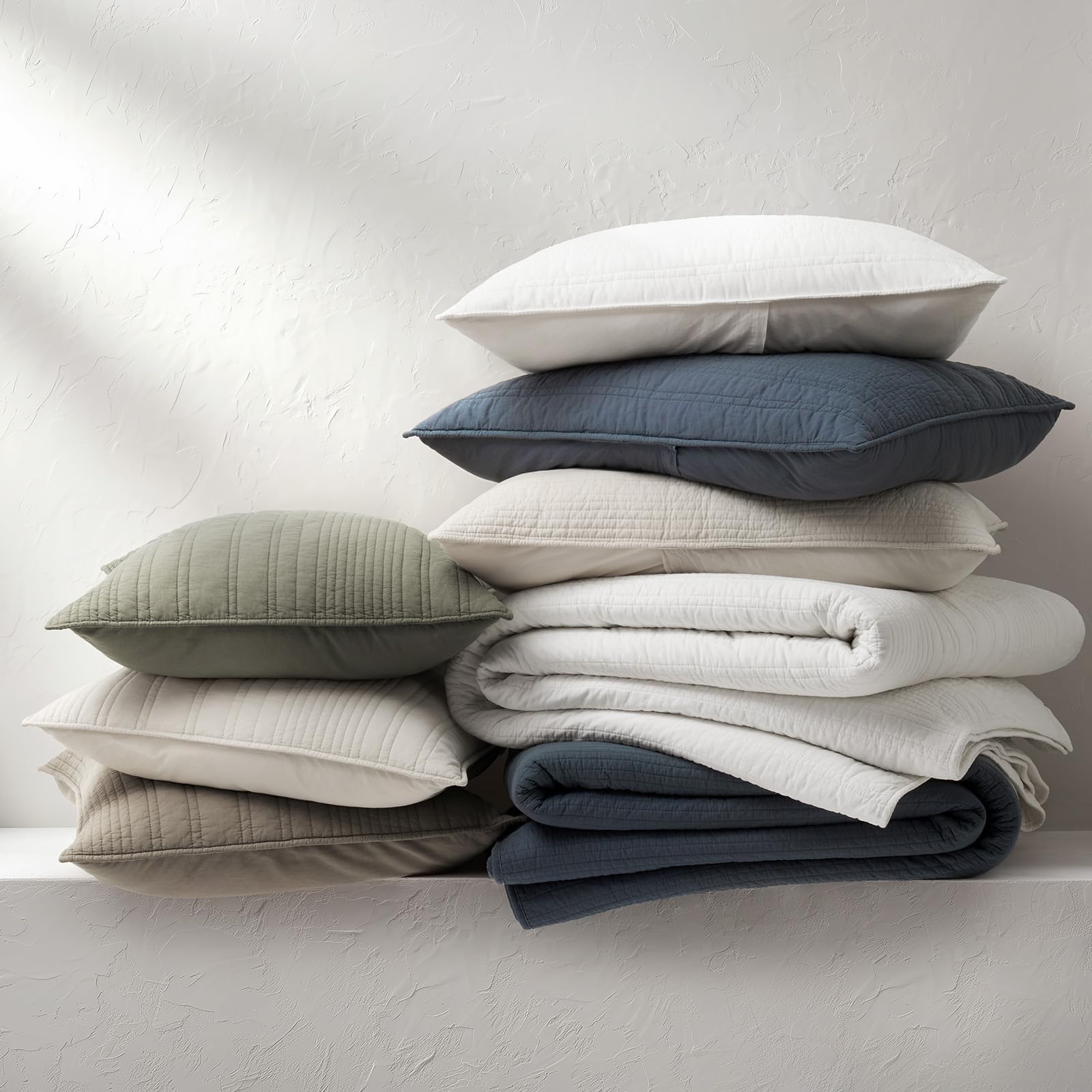 EverGrace quilt layered with blankets to show versatile styling
