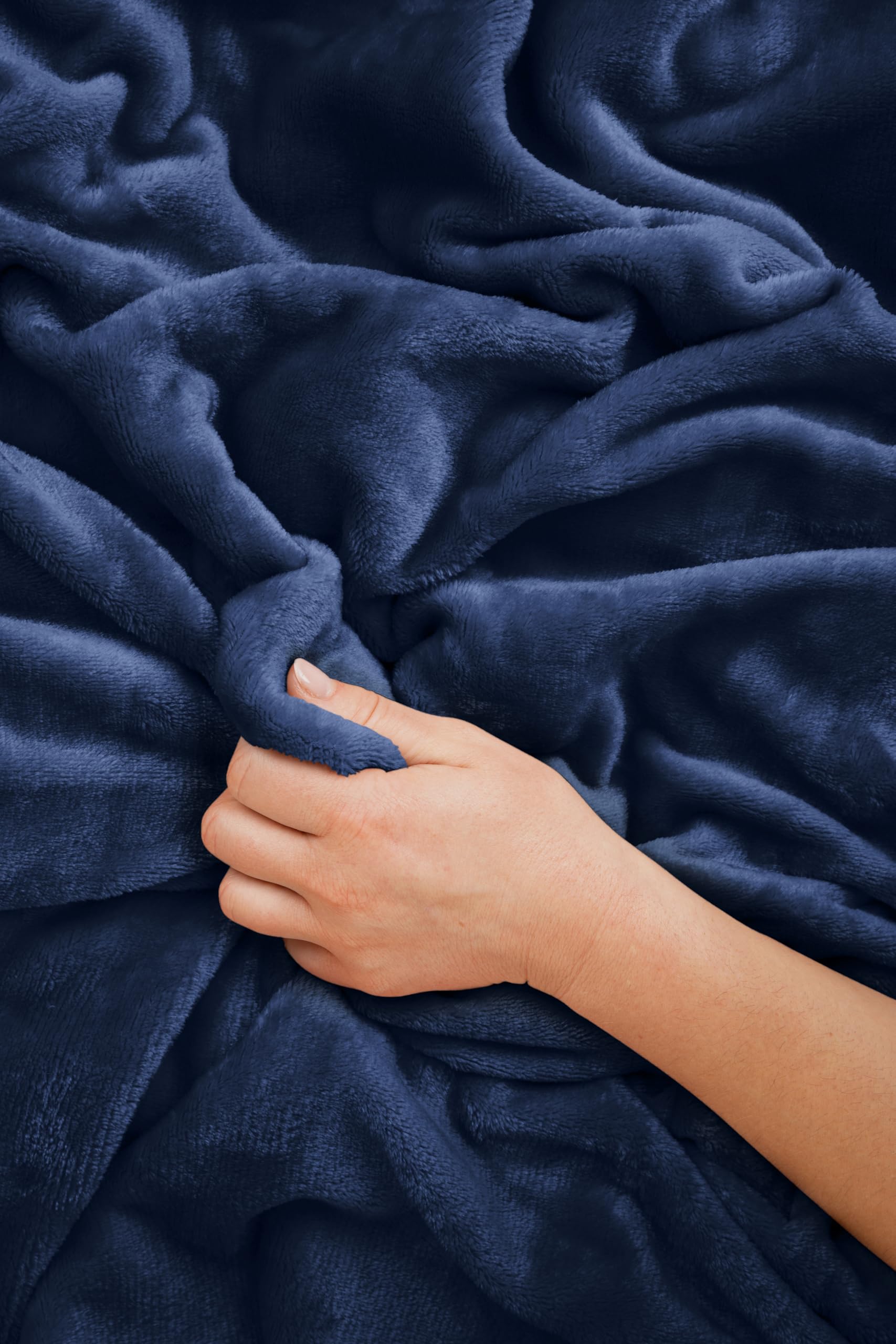 EverSnug blanket folded compact in hand showing portable size and convenience