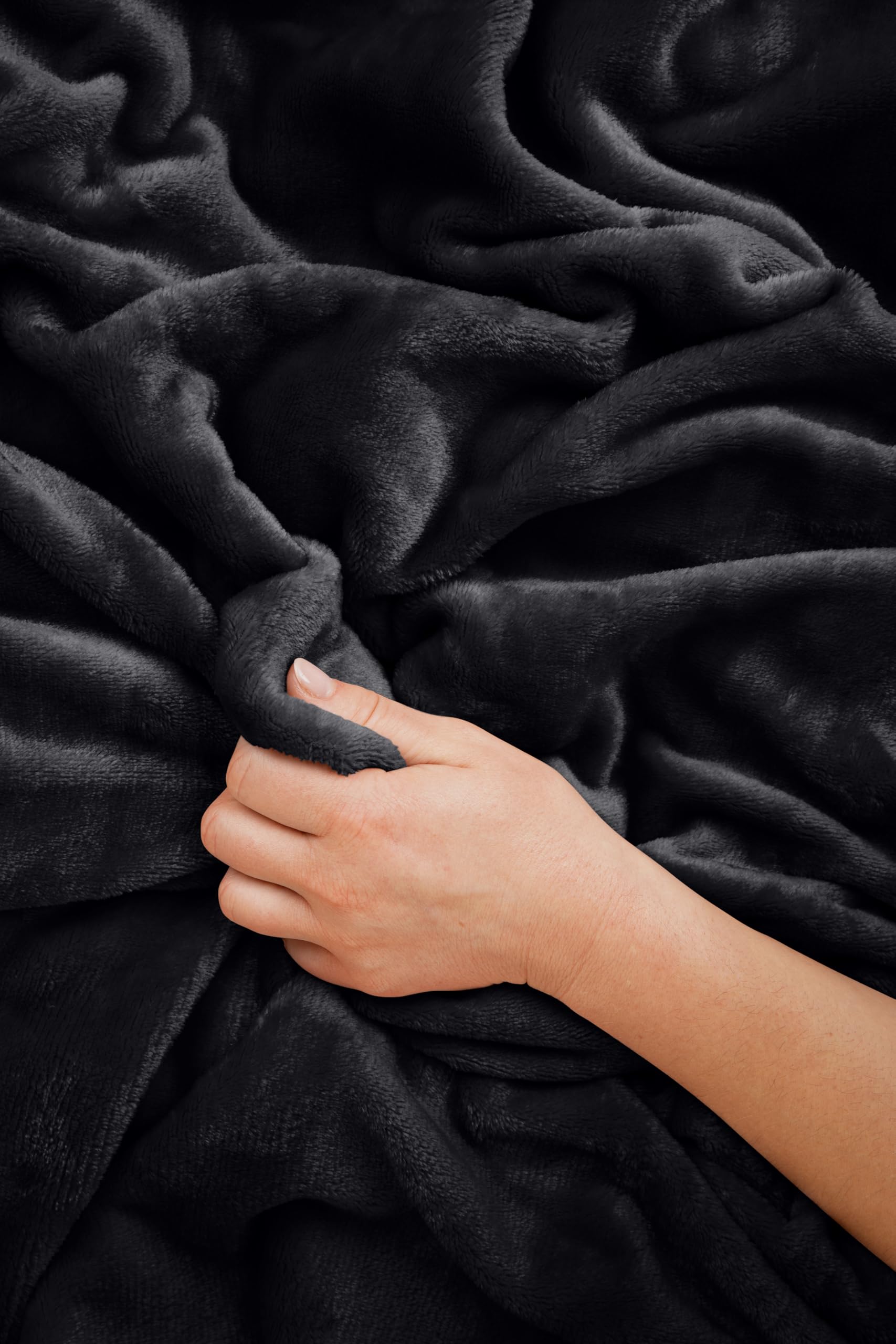 EverSnug blanket beside travel items showing 65x40 inch scale for coverage