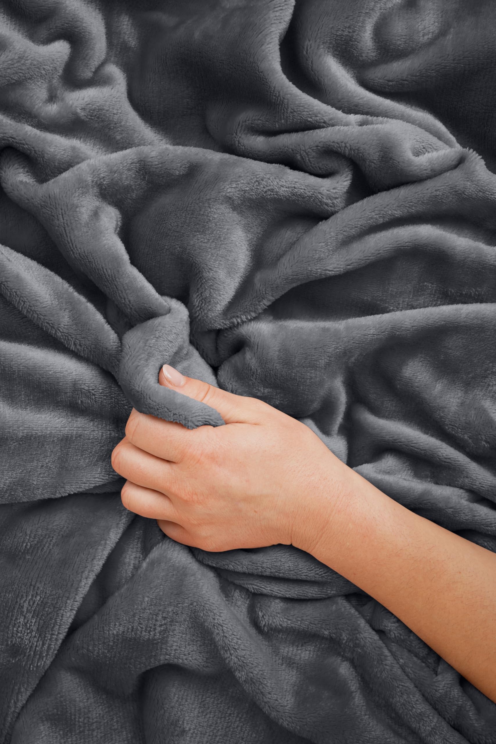 EverSnug in plane seat showing use as blanket and pillow — cozy travel comfort