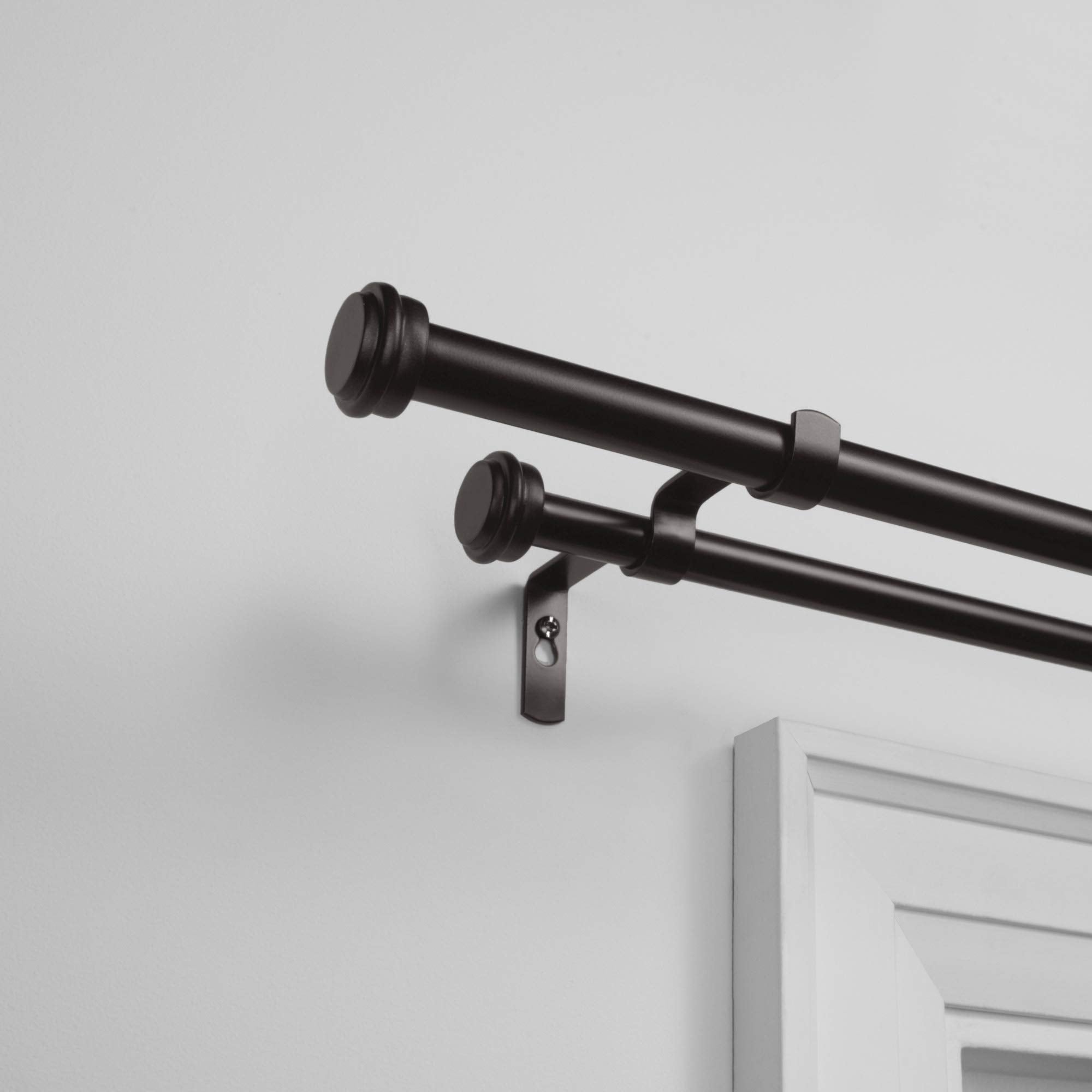 Exclusive Home finial close-up with flat button detail, provides subtle decorative accent