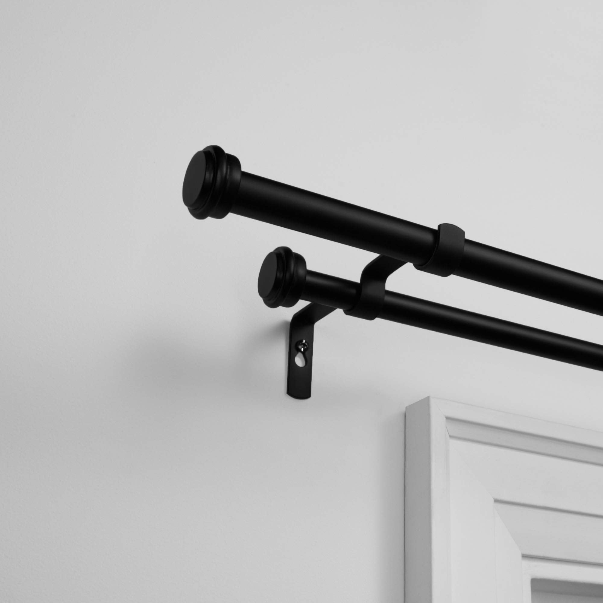 Exclusive Home close-up of flat finial detailing showing durable matte-black finish and clean profile