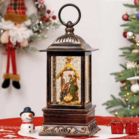 Eyrosa nativity lantern front view showing vintage bronze frame and gift-ready packaging — elegant holiday décor