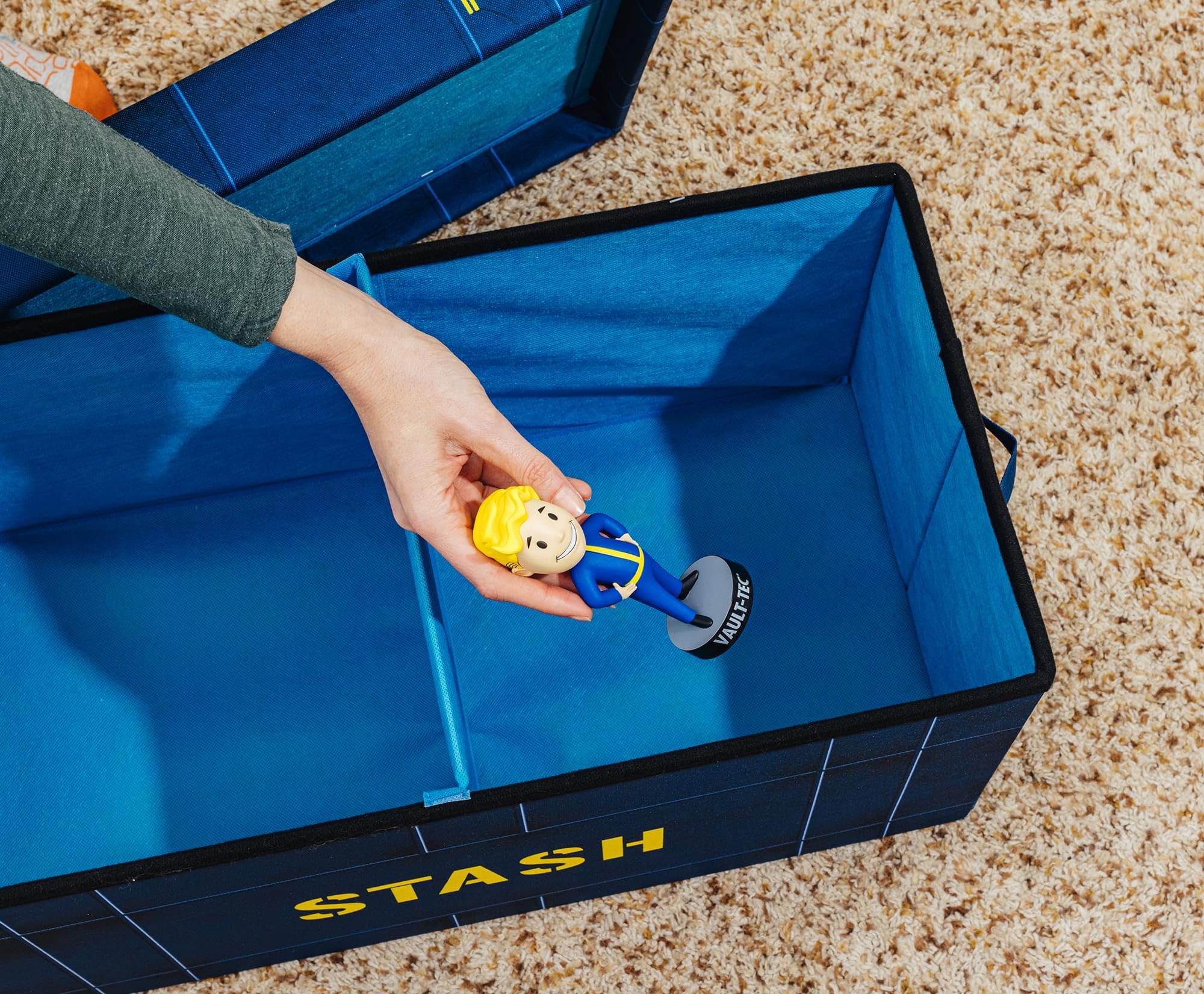 Fallout Vault-Tec scale with game controller to show 24x12 size and fit benefit
