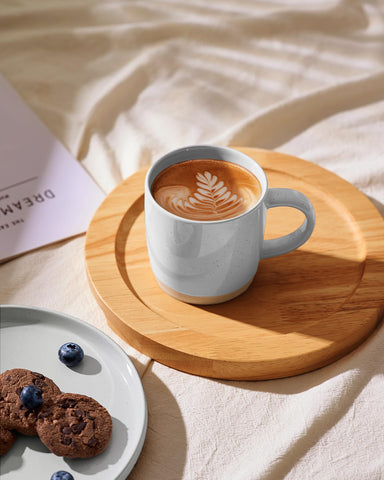 famiware mug held in hand showing 13 oz scale and ergonomic comfort benefit