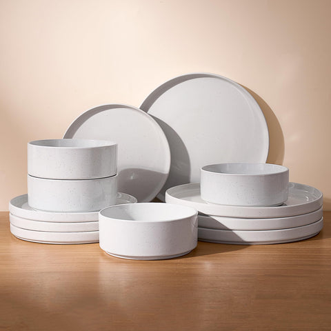 Famiware front view of full set showing white speckled dinnerware and organized layout