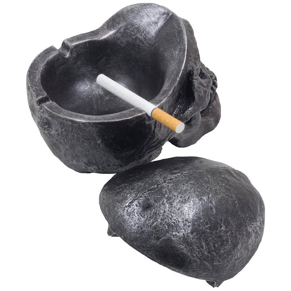 Fane skull ashtray beside a book showing size and decorative placement benefit