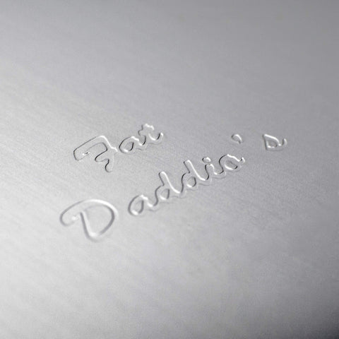 Fat Daddio's pan beside a spatula showing size and capacity for family meals