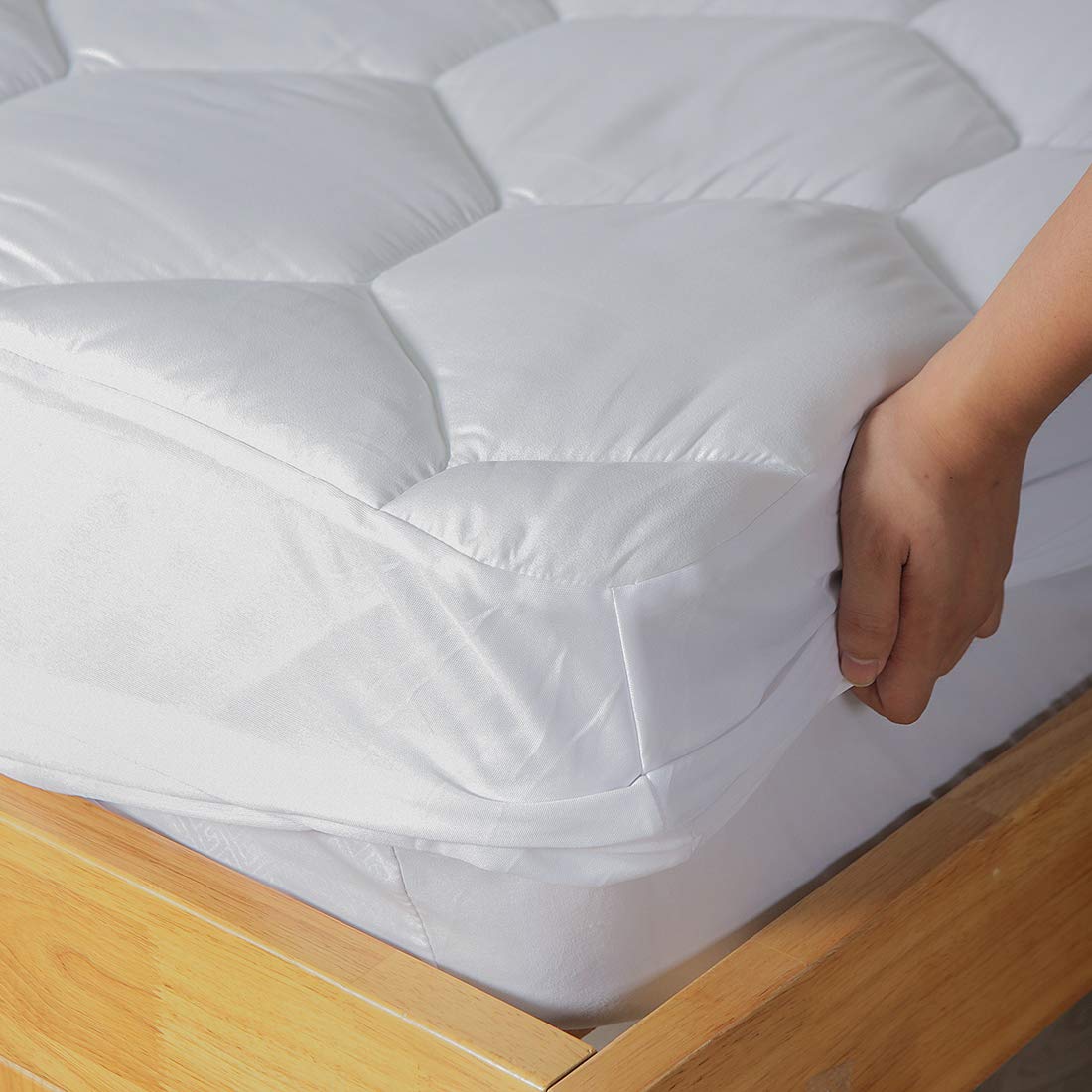 Favorland mattress pad on a twin bed in bedroom scene offering neat, breathable sleep