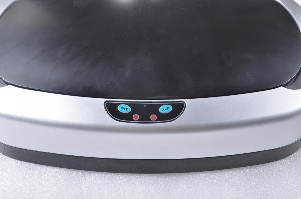 FDW trash can beside cabinets showing compact footprint and space-saving benefit