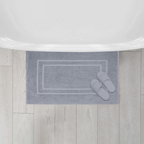 Feather & Stitch New York hands pressing plush surface showing cushioned comfort