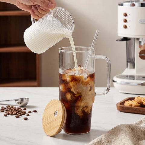 FECBK tumbler next to hand for size scale and easy large-capacity hydration