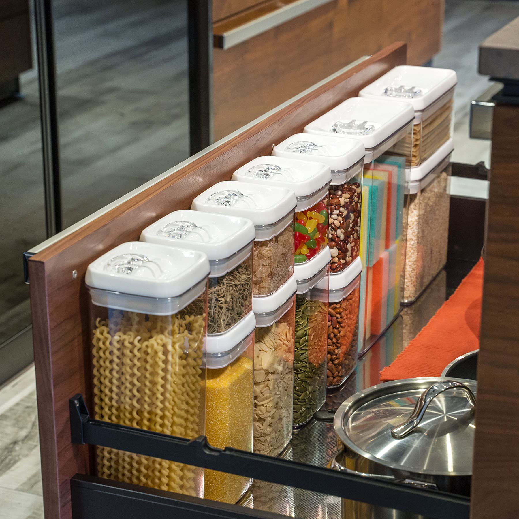 Felli open canister in use with one hand displaying convenient pouring and multitasking benefit