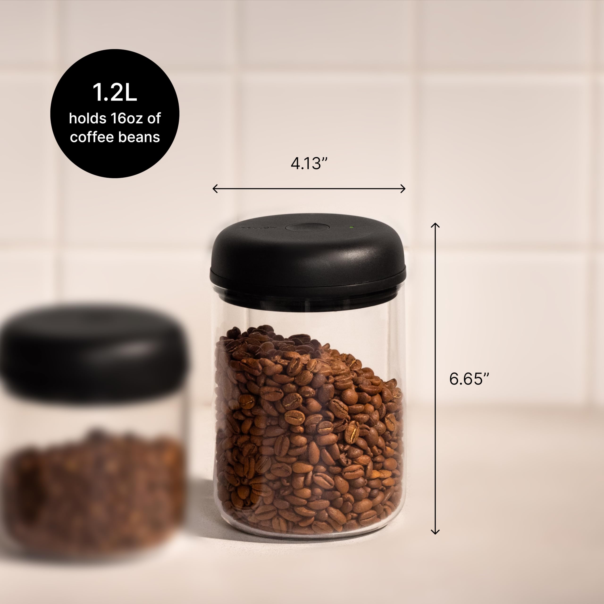 Fellow Atmos with whole coffee beans visible for freshness control