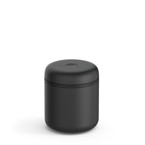 Fellow Atmos front view showing sleek stainless-steel jar and lid, keeps coffee fresh