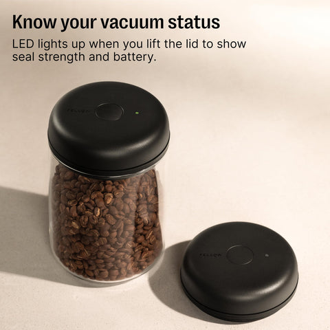 Fellow Atmos in use with a hand twisting lid for easy vacuuming