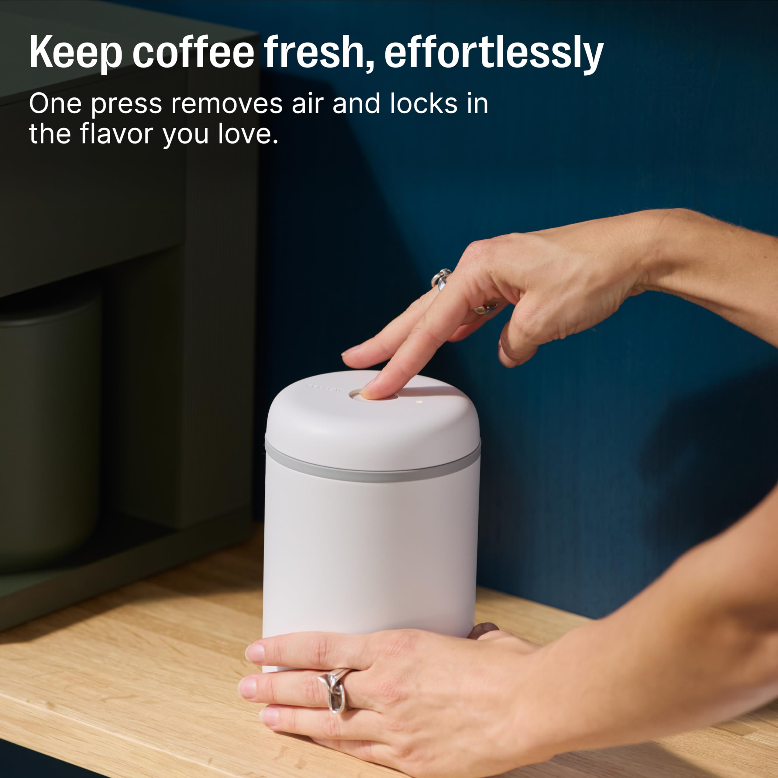 Fellow Atmos open top with whole-bean coffee inside, protects aroma and freshness