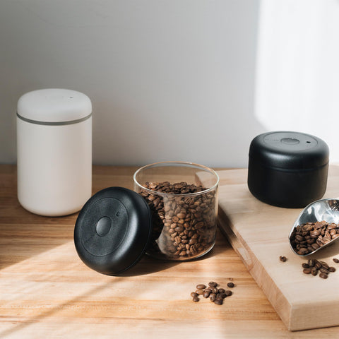 Fellow Atmos open filled with coffee beans to preserve aroma and freshness
