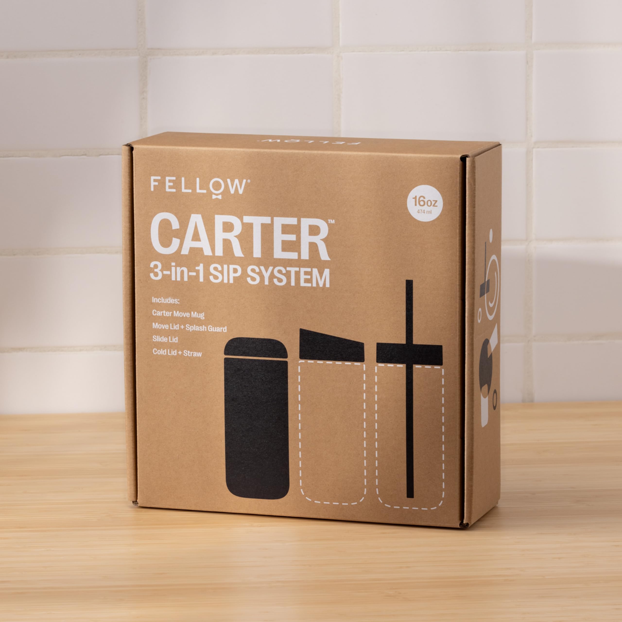 Fellow Carter on outdoor table with iced drink showcasing portable convenience
