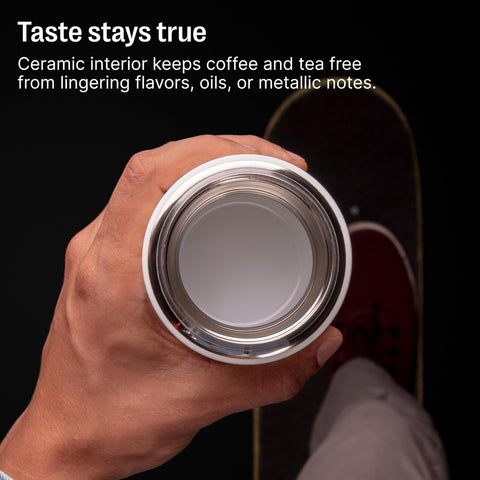 Fellow Carter Slide one-handed slide lid demonstrated with thumb for quick sip and leak protection