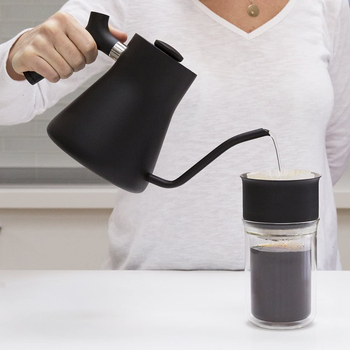 Fellow Stagg in kitchen during pour‑over brew demonstrating practical use