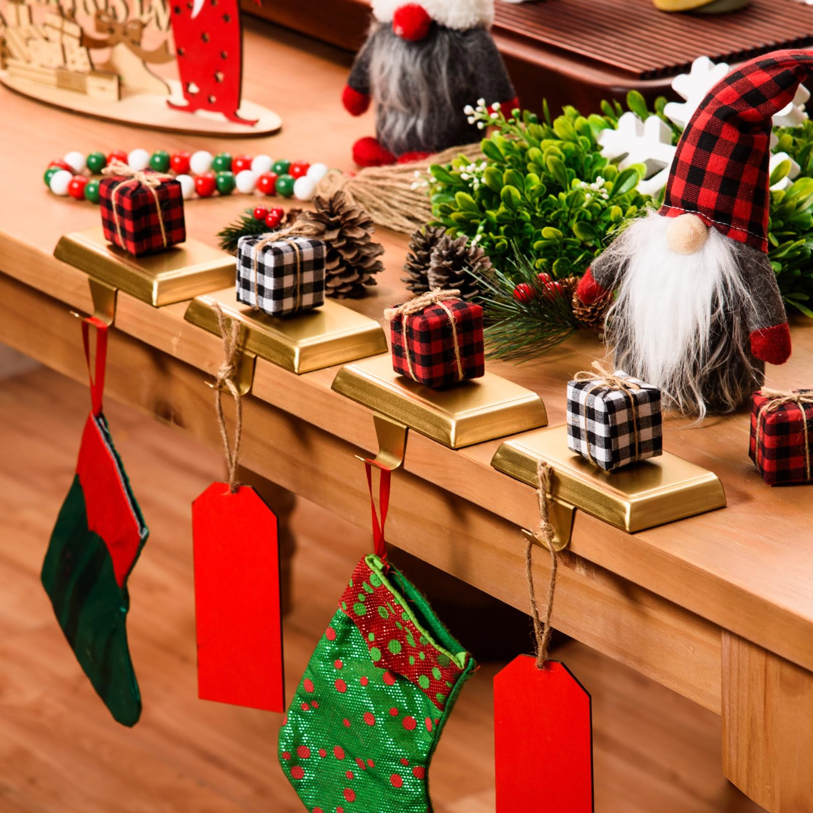 Festanlee holders styled by fireplace conveying warm seasonal decor appeal