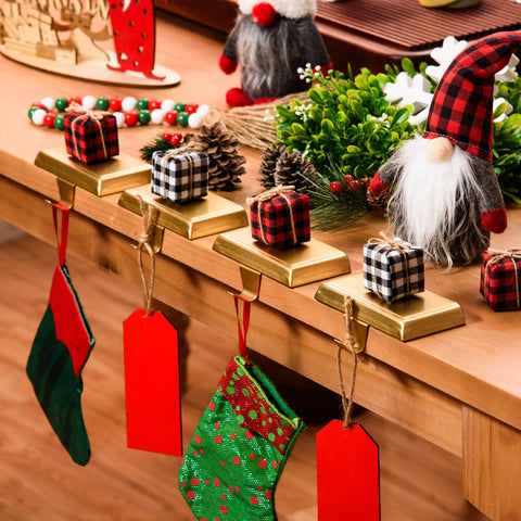 Festanlee holders styled by fireplace conveying warm seasonal decor appeal