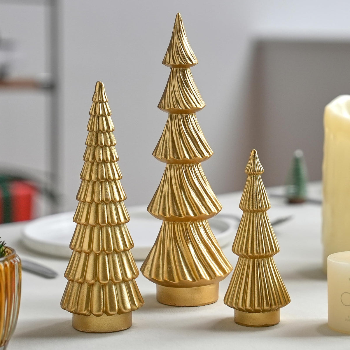 FESTGLOX front view of three gold resin trees showing cohesive set and visual height