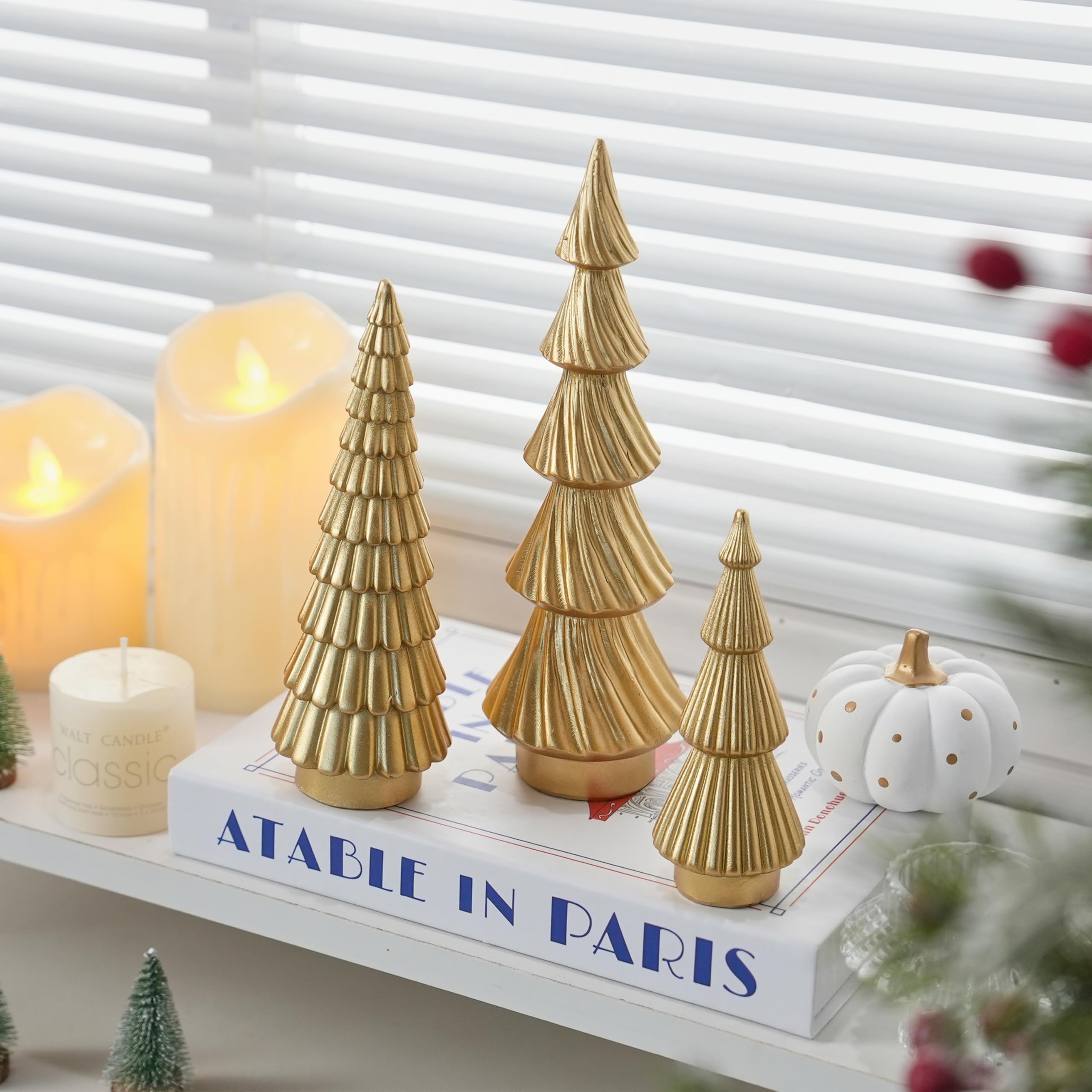FESTGLOX trio on mantel demonstrating seasonal styling and warm reflective sheen