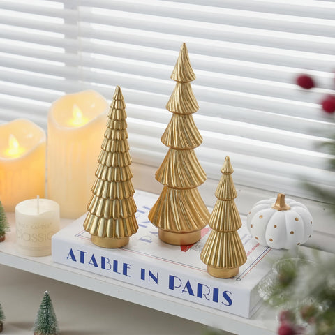 FESTGLOX trio on mantel demonstrating seasonal styling and warm reflective sheen
