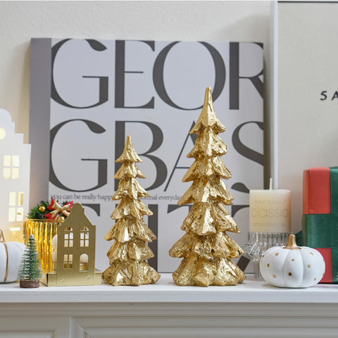 FESTGLOX trees next to candle illustrating scale and complementary décor use