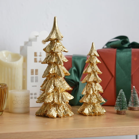 FESTGLOX trees on decorative tray beside ornaments for cohesive centerpiece benefit