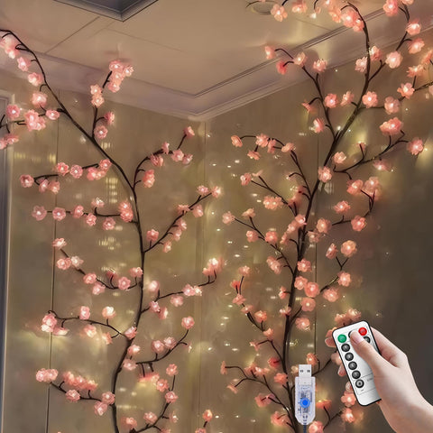 FIALAME front view of pink cherry blossom garland showing soft LEDs and branches for cozy ambience