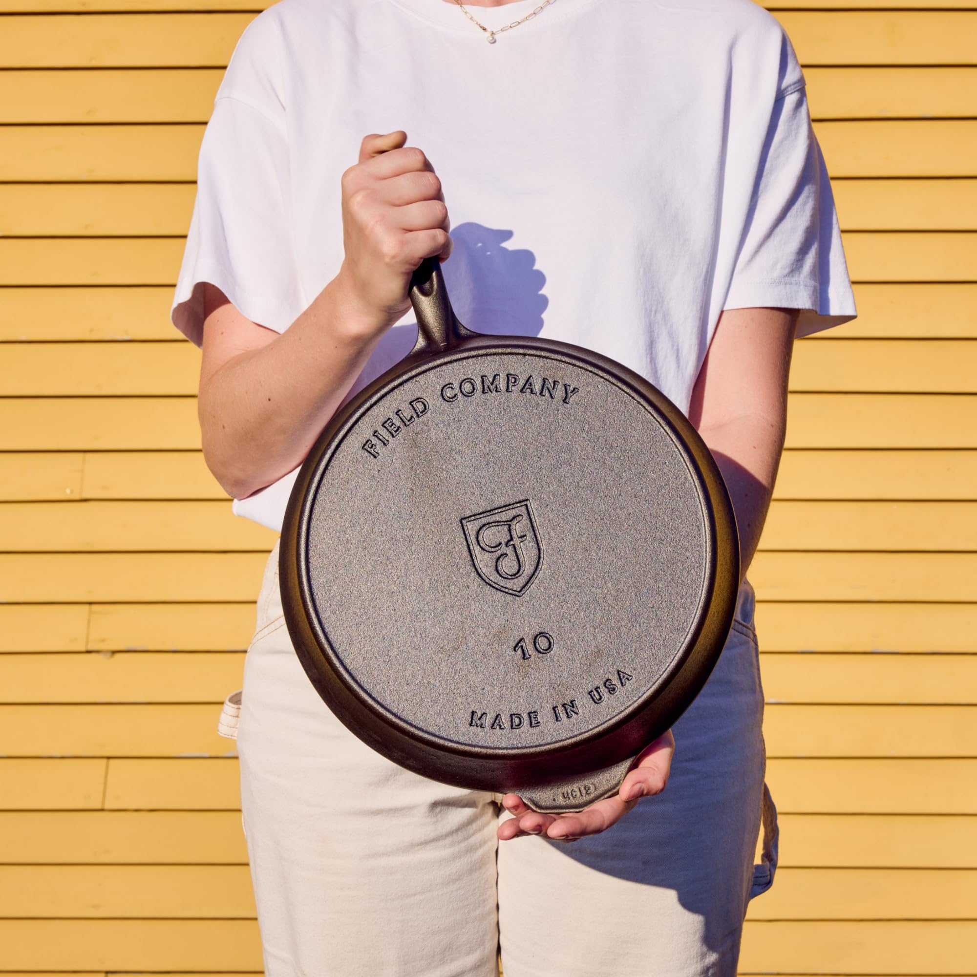 Field Company skillet next to spatula and plate to demonstrate scale and portioning