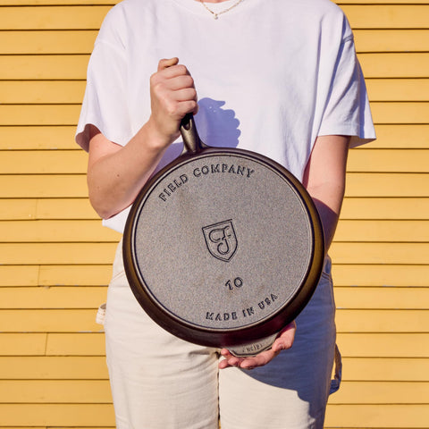 Field Company skillet next to spatula and plate to demonstrate scale and portioning