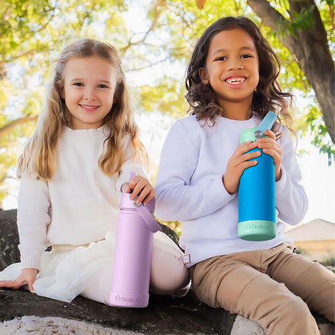 Fimibuke bottle on playground table showing durable travel-ready hydration
