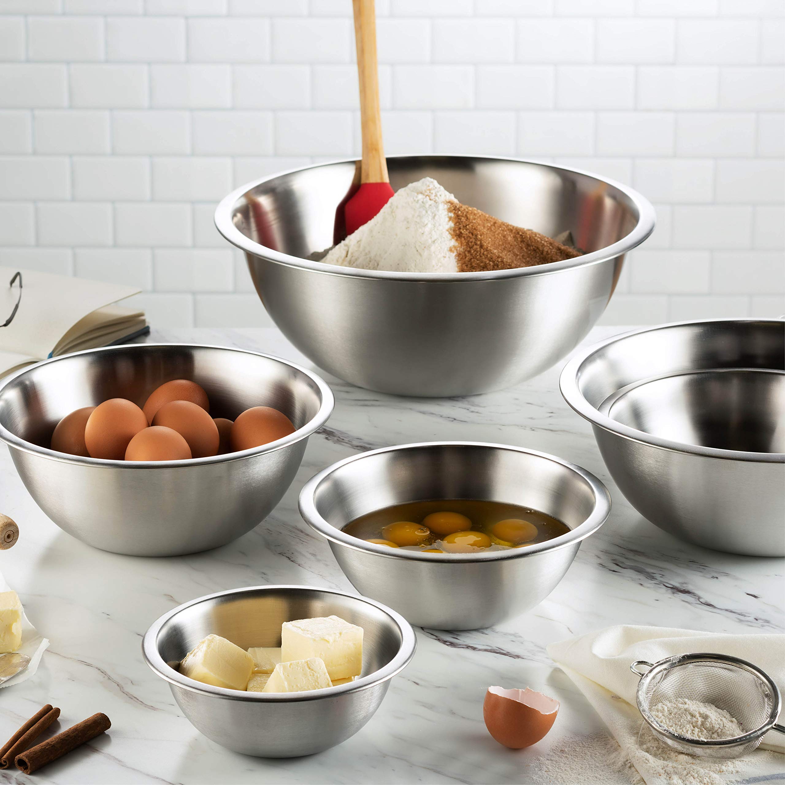 FineDine bowl in use with whisk whipping cream showing stable base and splatter control