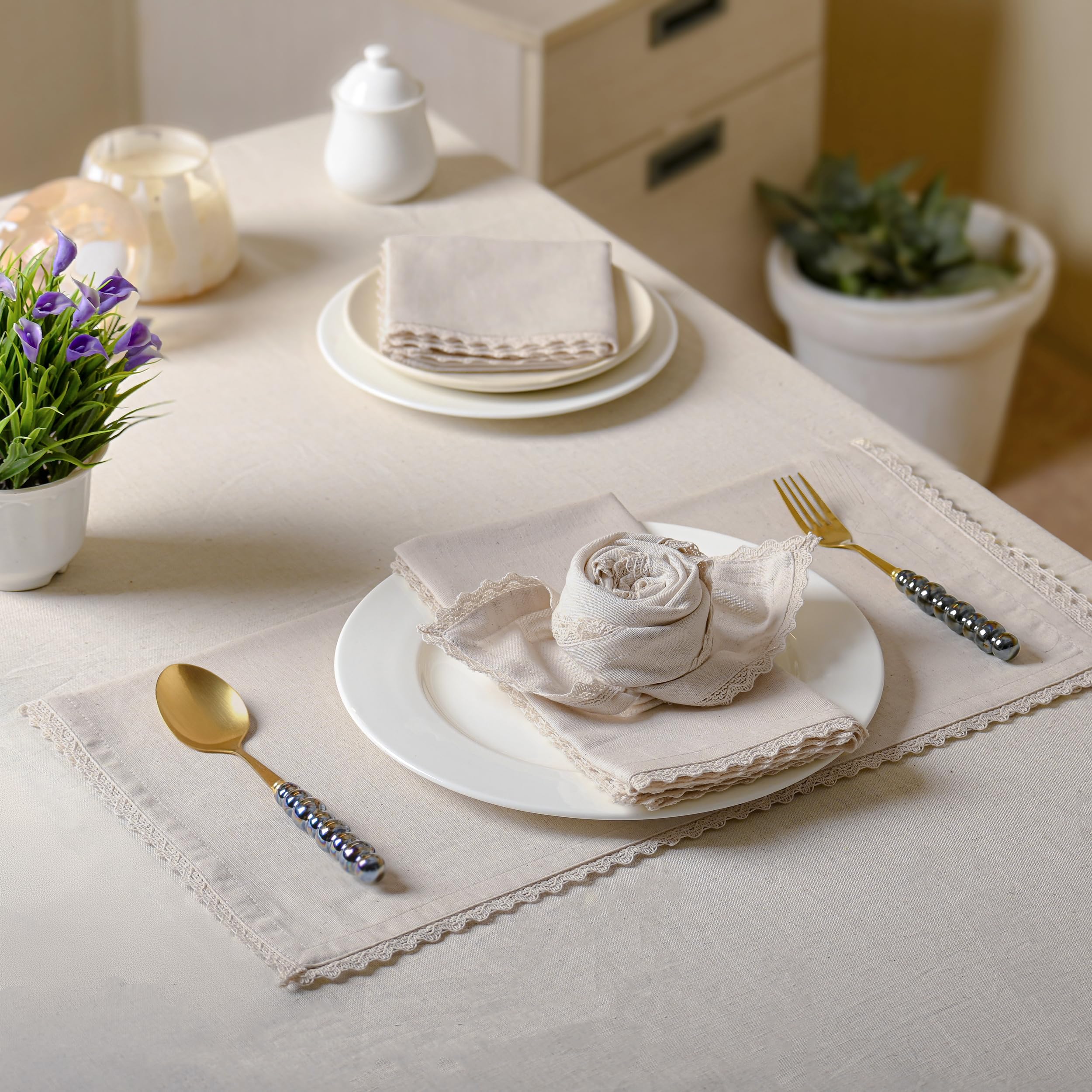 FINGERCRAFT napkin held in hand showing oversized 20x20 inch scale advantage