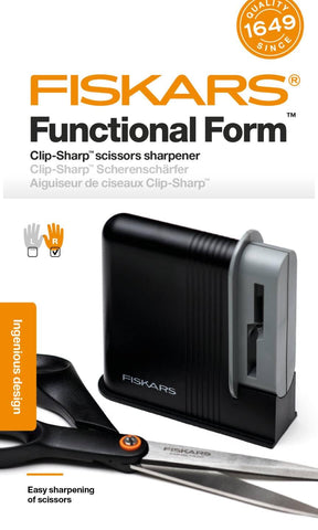 Fiskars Clip-Sharp next to coin showing 4 cm size and portability benefit
