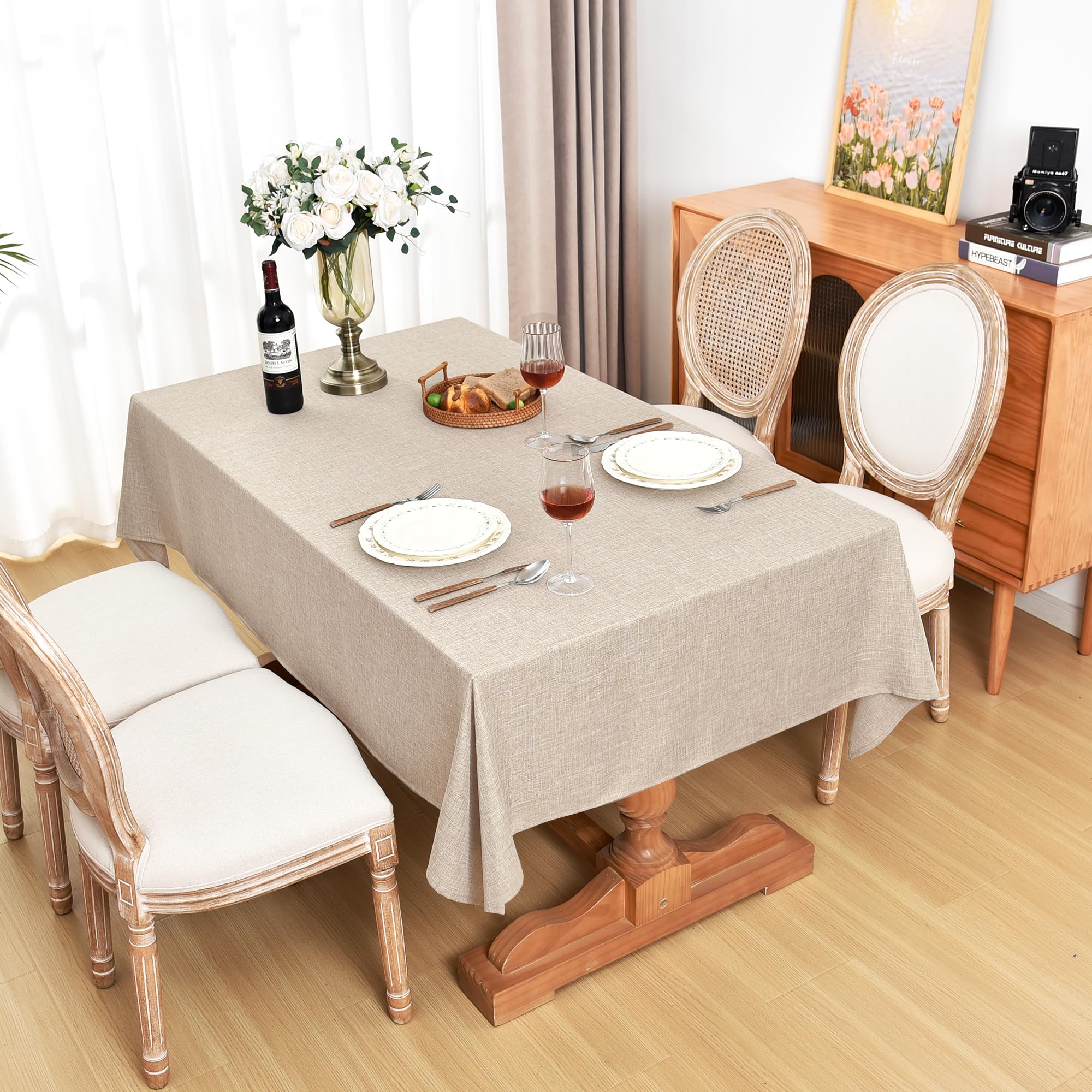 Fitable cloth on table with chair for scale showing full coverage