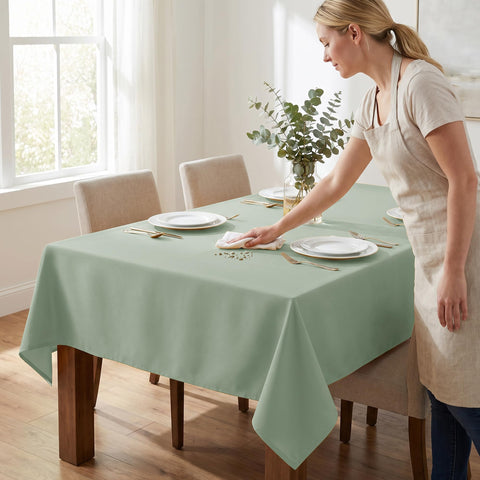 Fitable table set with dinnerware displaying elegant sage color for events