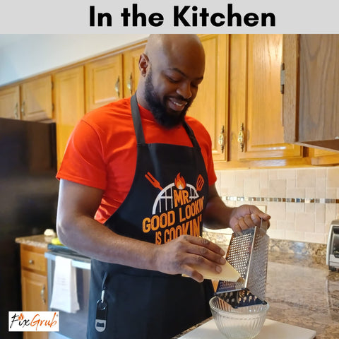 FixGrub apron worn by grillmaster lifestyle scene showing practical use