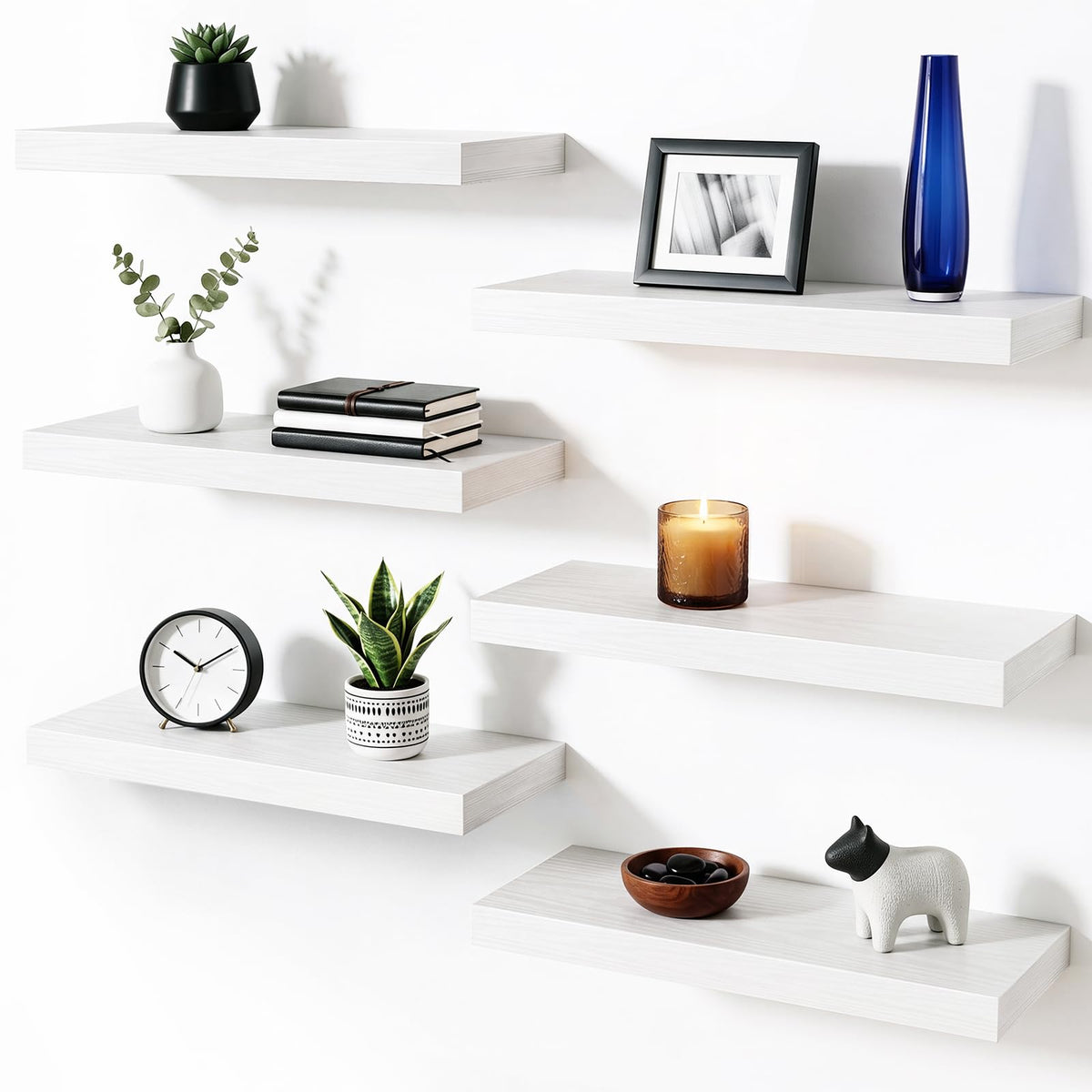 Fixwal front view of six white floating shelves showing neat storage benefit