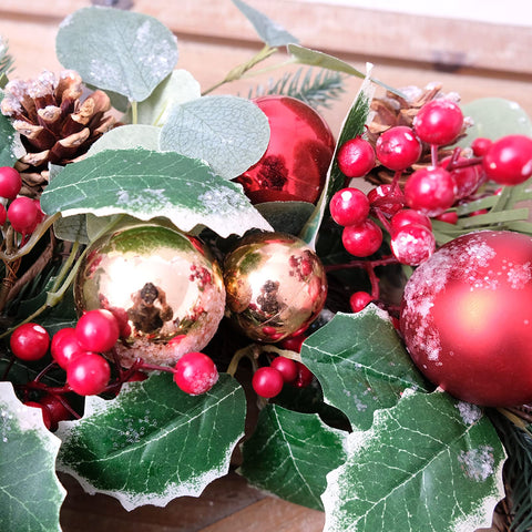 Floribus wreath styled on an entryway for warm holiday welcome