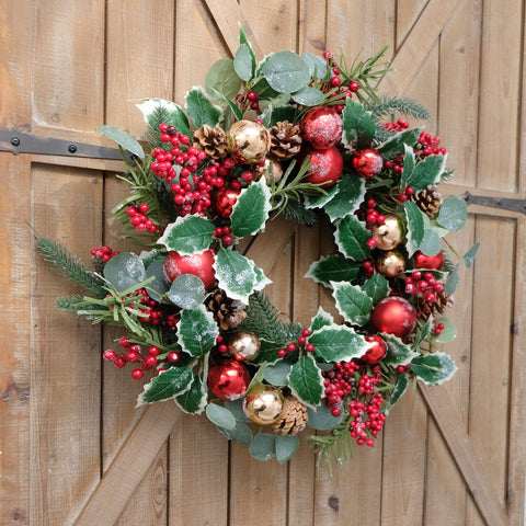 Floribus wreath hanging on covered porch for protected display