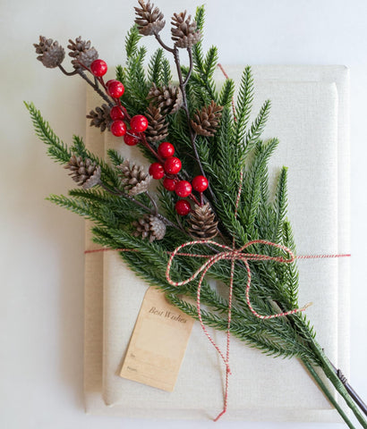 florisso mantel display with garland made from stems, creates festive ambiance