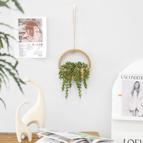 Floweroyal next to a hand for scale showing compact size benefit: perfect for small spaces