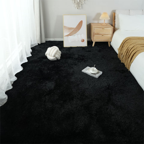 Fluffyrug styled next to bed to show bedside warmth and comfort