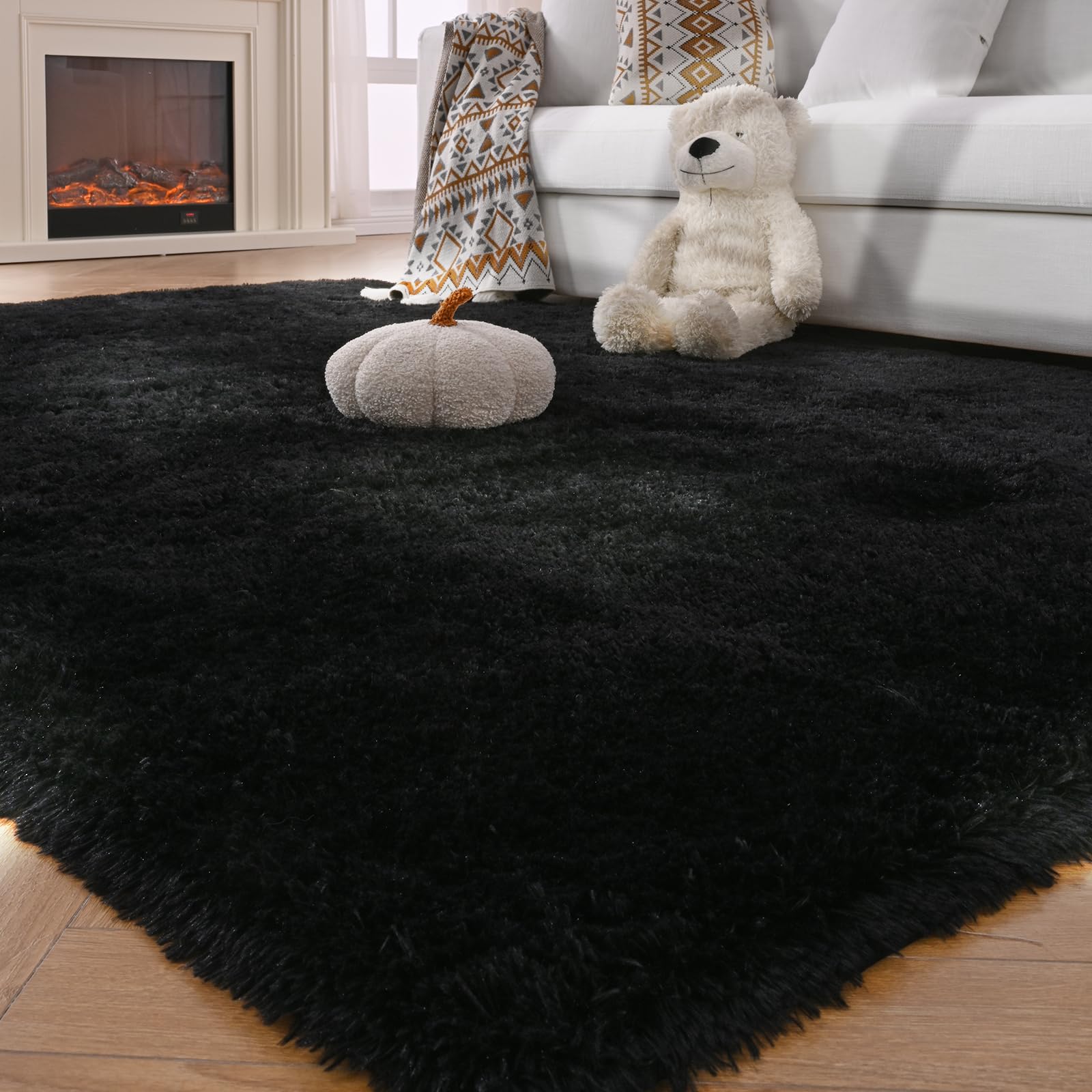 Fluffyrug next to sofa demonstrating 5x7 scale and room fit