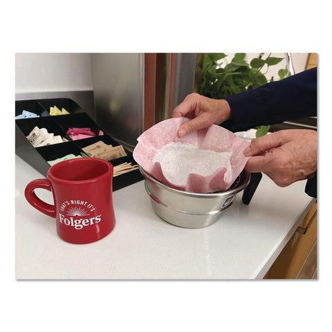 Folgers spent filter pack being discarded illustrating low-touch cleanup advantage